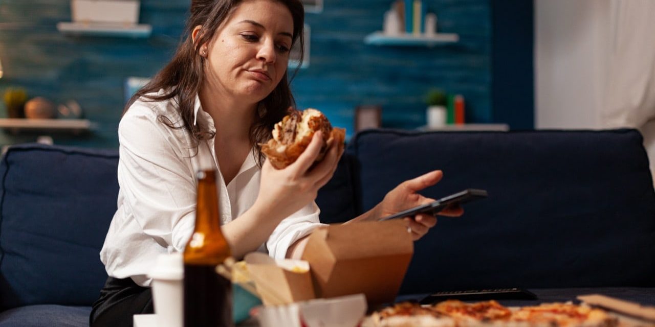 young-woman-using-phone-while-sitting-table_JPG1280
